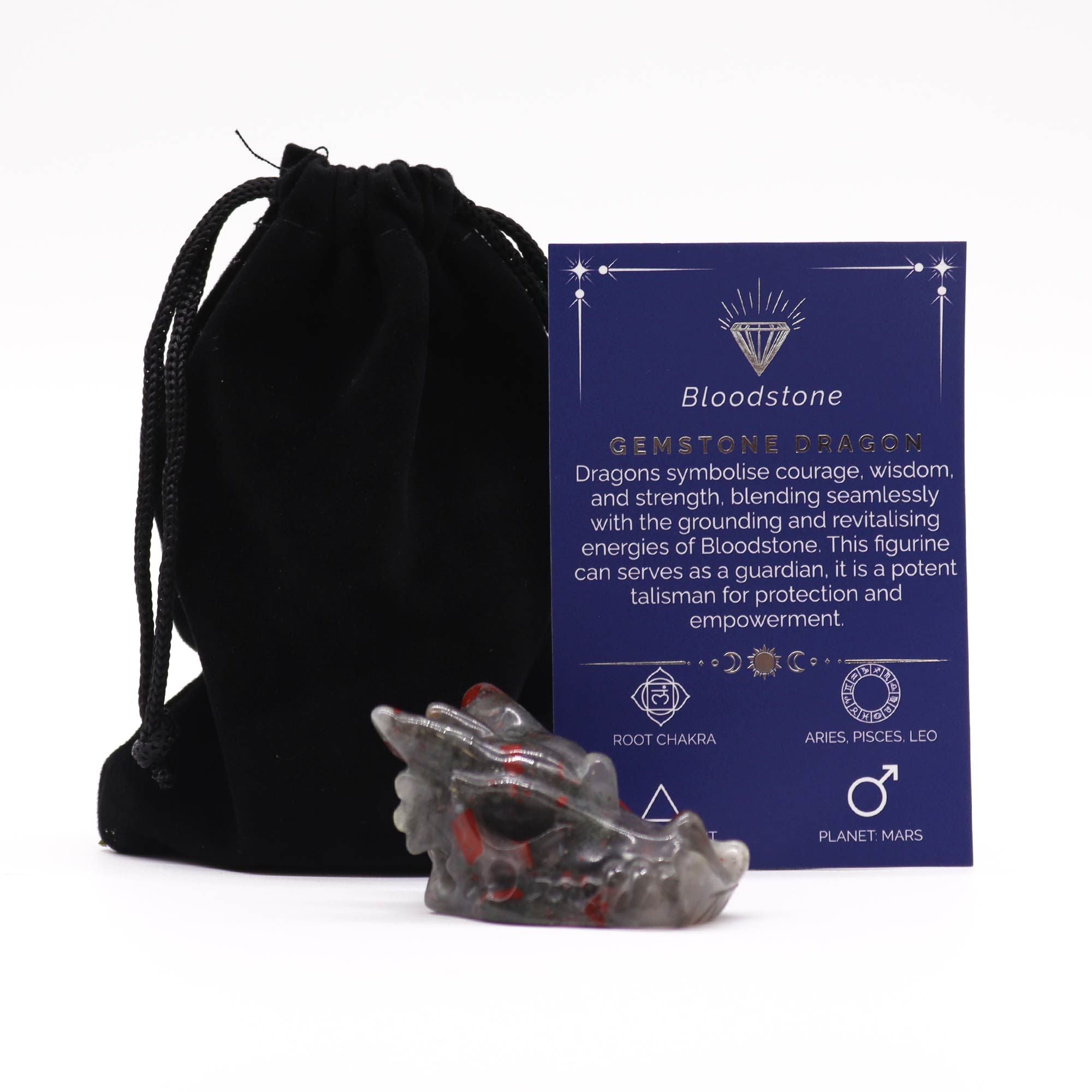Crystal dragon figurine with a card explaining its properties, next to a black drawstring bag on a white background.