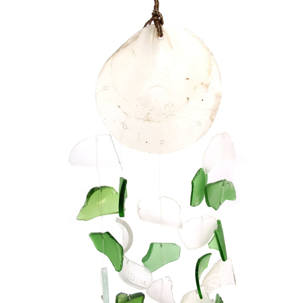 Decorative hanging with green and white glass pieces on a white background