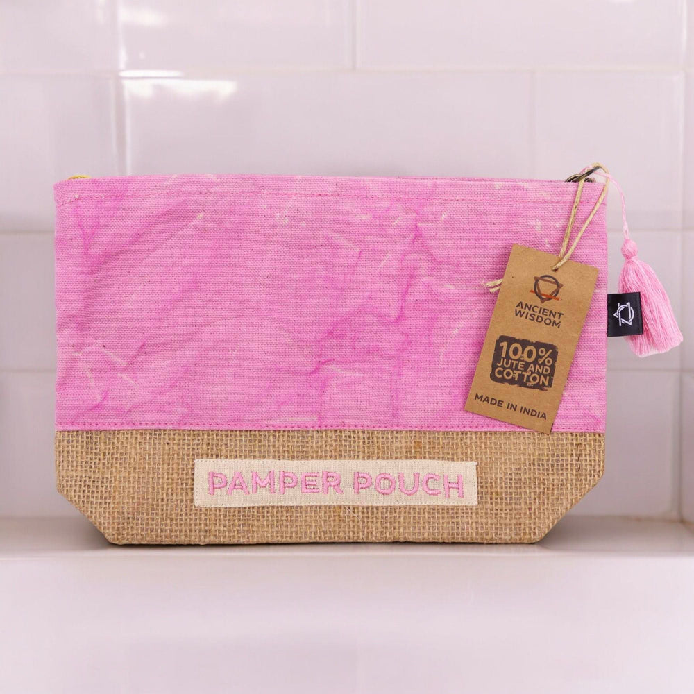 Pink and natural fabric pouch with 'Pamper Pouch' label and tag on a white background