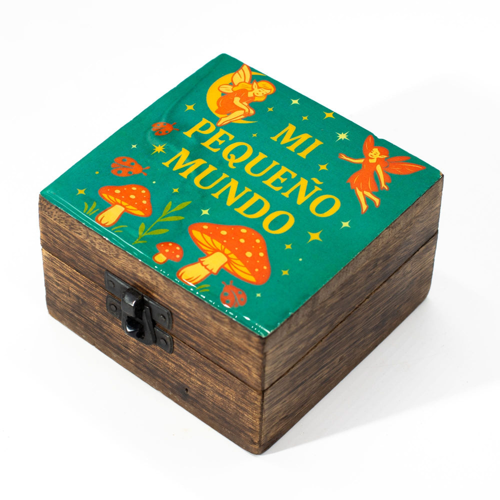 Wooden box with fairy and mushroom design on a green background