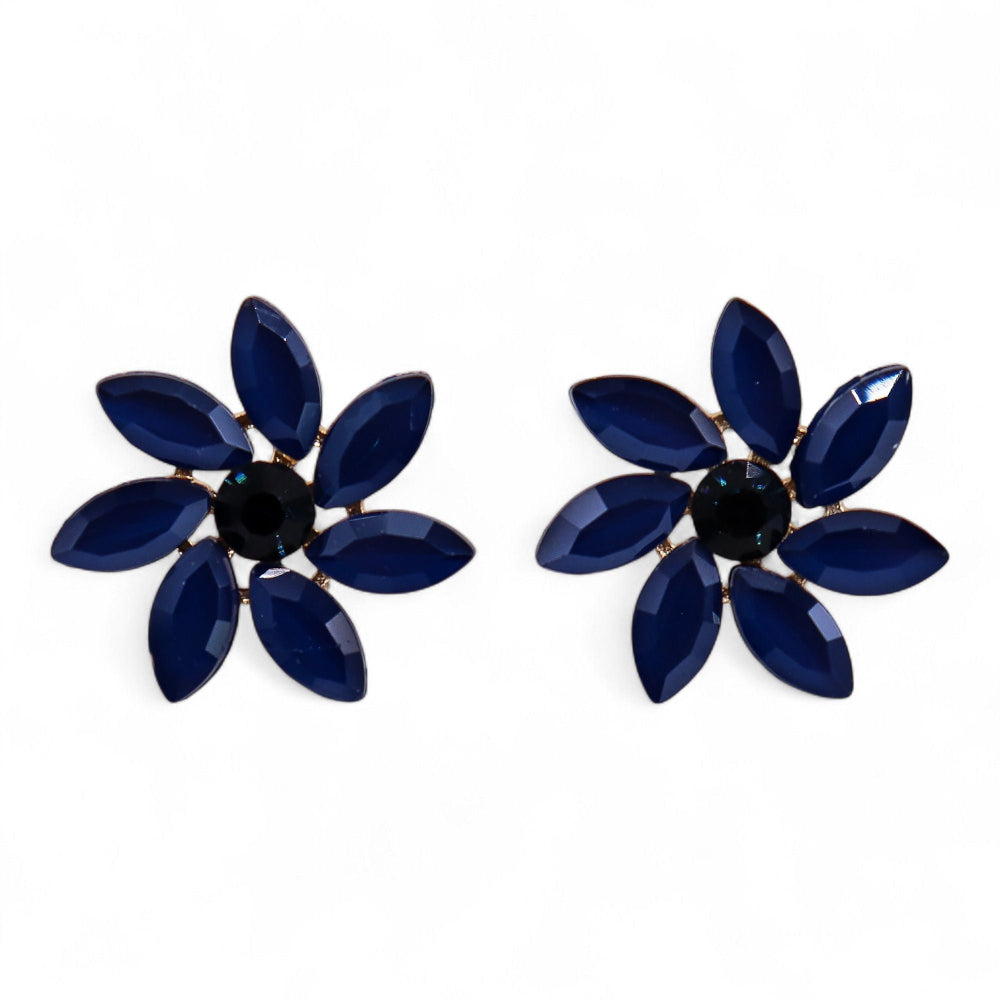 Pair of blue flower-shaped earrings with a black center on a white background
