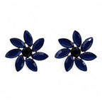 Pair of blue flower-shaped earrings with a black center on a white background