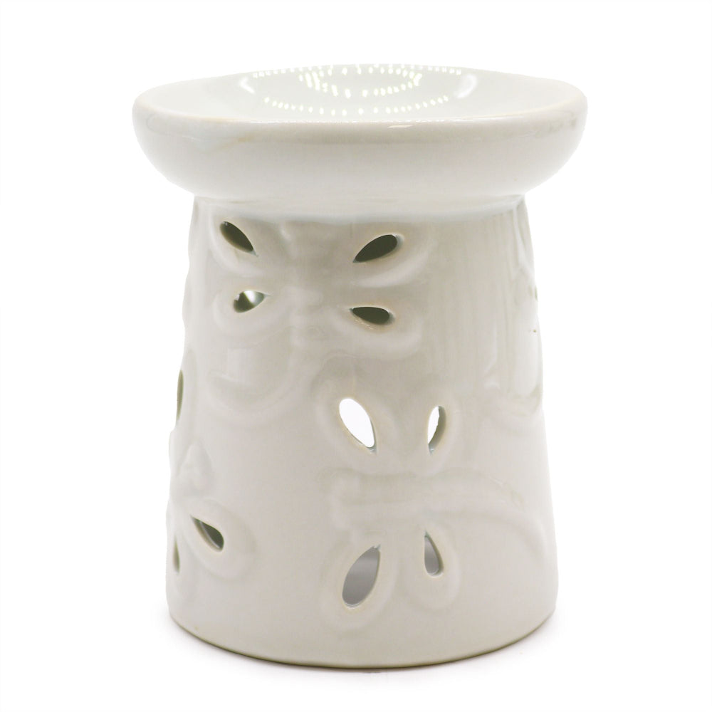 White ceramic oil burner with a textured design on a white background