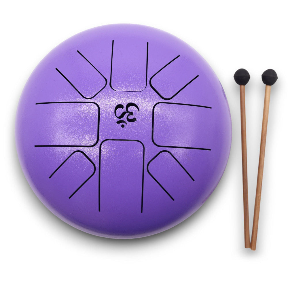 Purple steel tongue drum with two black mallets on a white background
