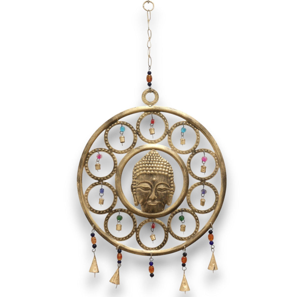 Decorative wall hanging with Buddha face design on a white background