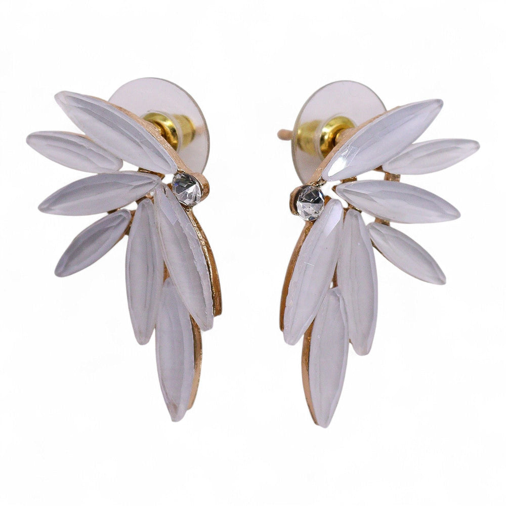 Pair of white floral earrings with gold accents on a white background