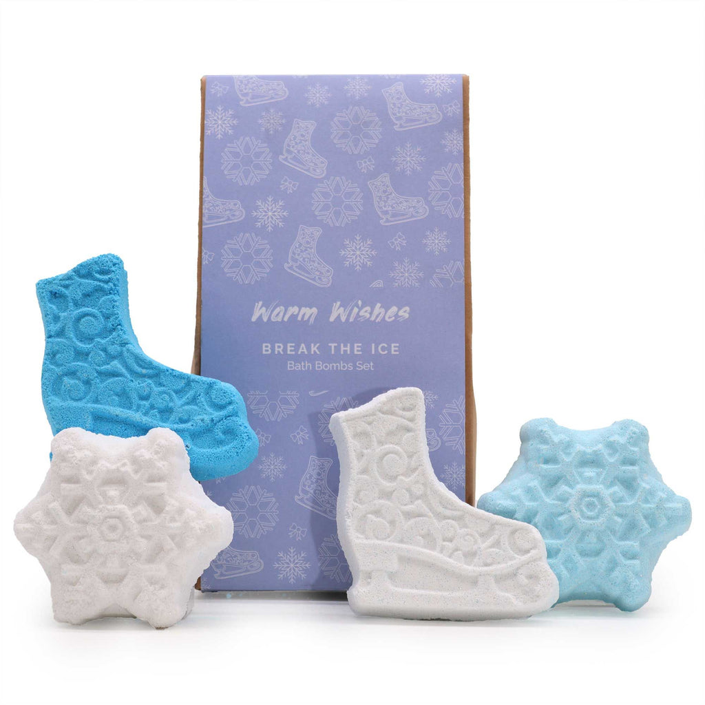 Set of bath bombs shaped like ice skates and snowflakes with a branded box on a white background.