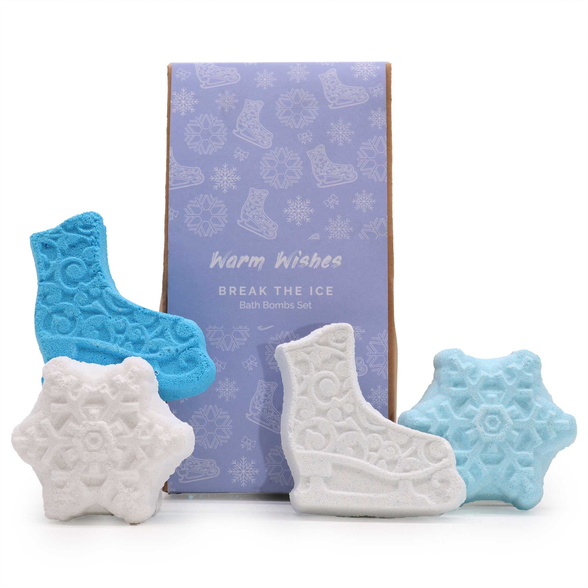 Set of bath bombs shaped like ice skates and snowflakes with a branded box on a white background.