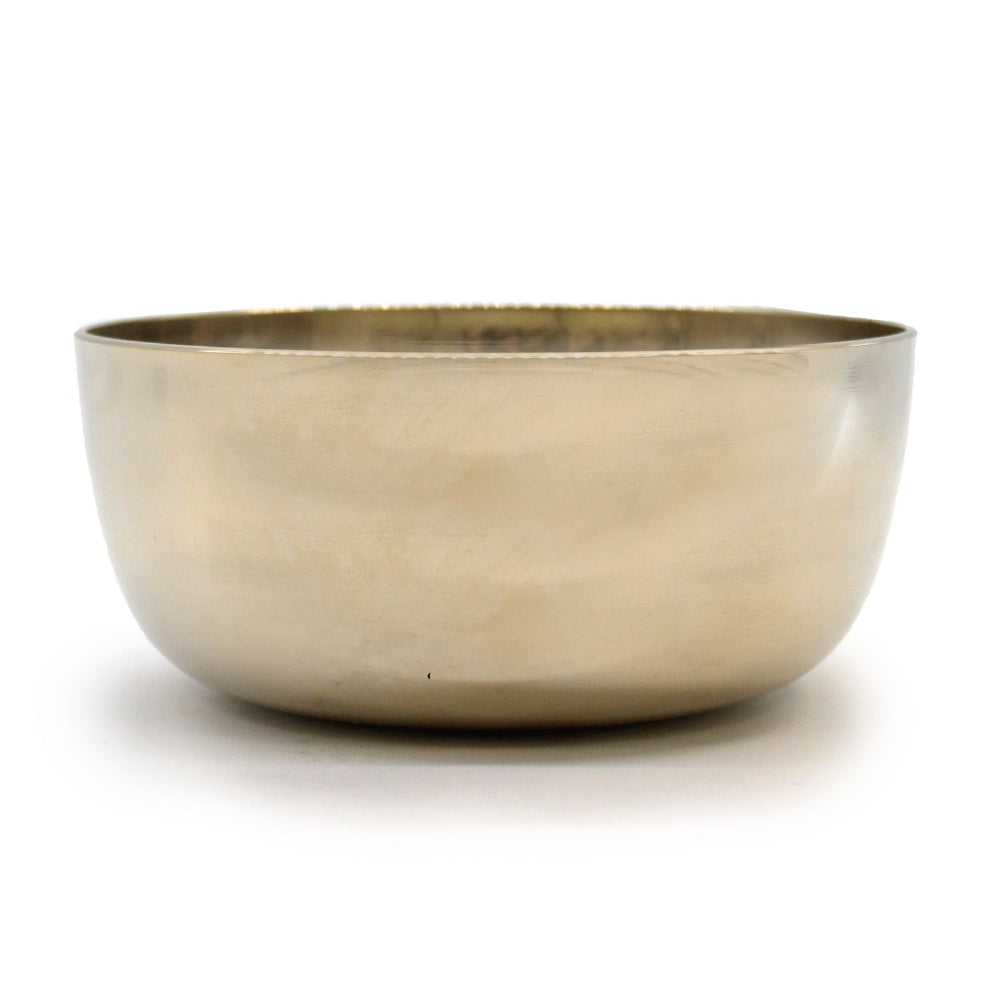 Brass bowl on a white background