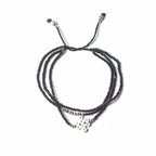 Multistrand beaded bracelet with a clasp on a white background