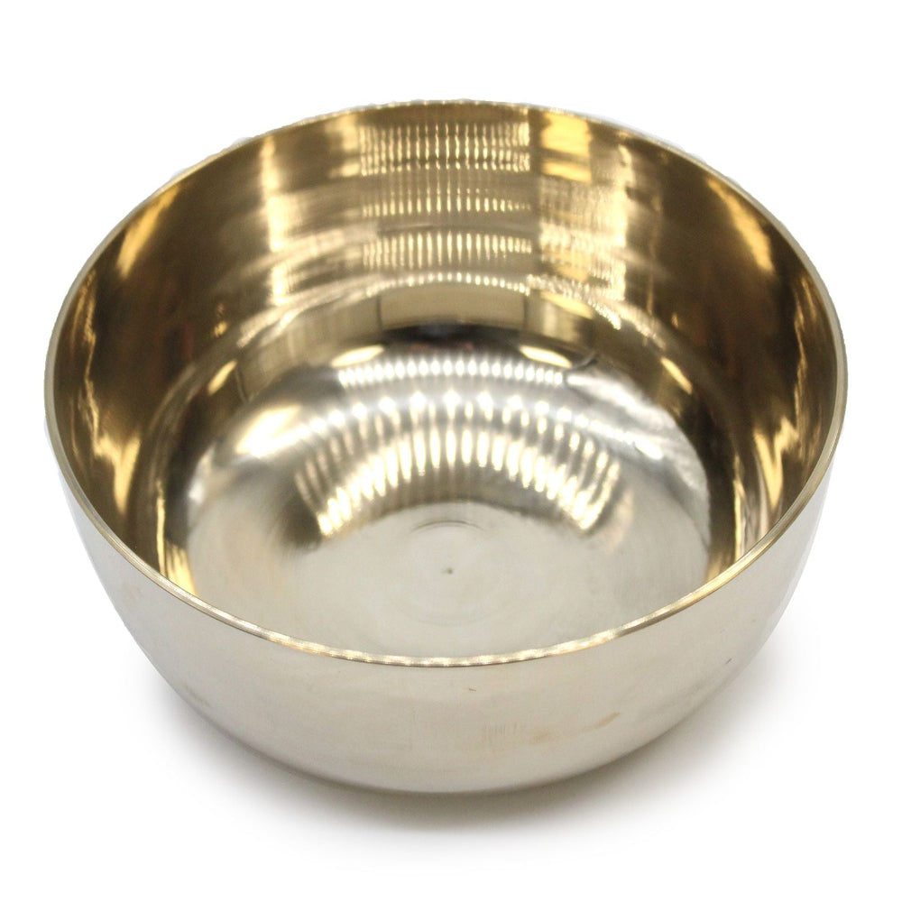Brass bowl on a white background