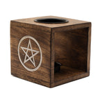 Wooden cube with pentagram design on a white background