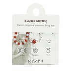 Packaging of a 'Blood Moon' nature inspired gemstone ring set with symbols and text.