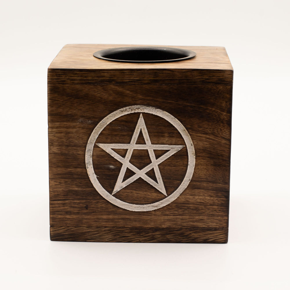 Wooden oil burner with pentagram design on a white background