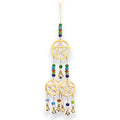 Decorative hanging with gold pentacle design and colorful beads on a white background