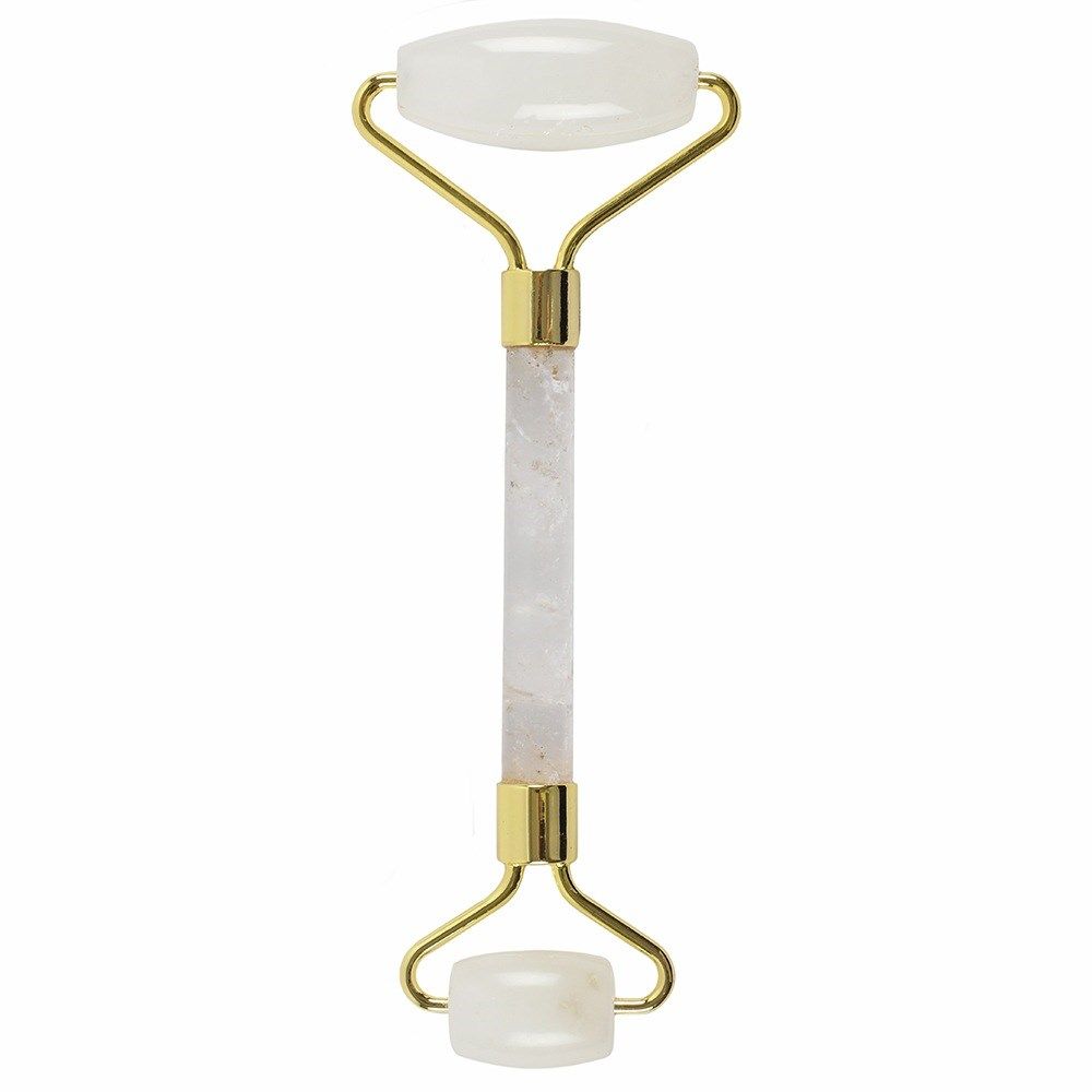 Facial roller with gold accents and white marble handle on a white background