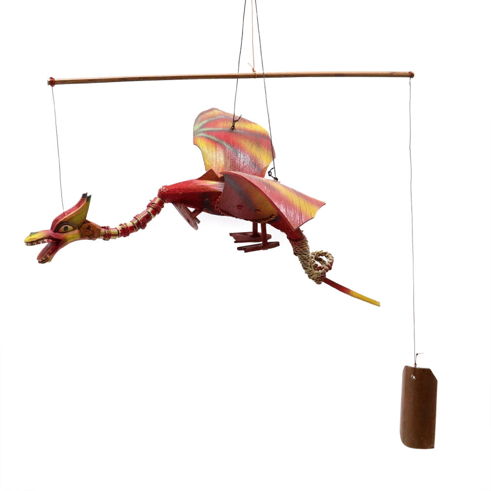 Colorful dragon-shaped wind chime on a white background