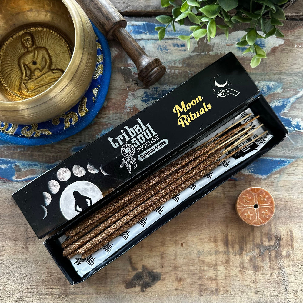 Box of Tribal Soul Incense with decorative items on a wooden surface