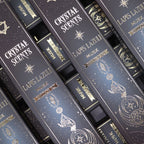 Stack of 'Crystal Scents' Lapis Lazuli Musk packaging with decorative text and symbols.