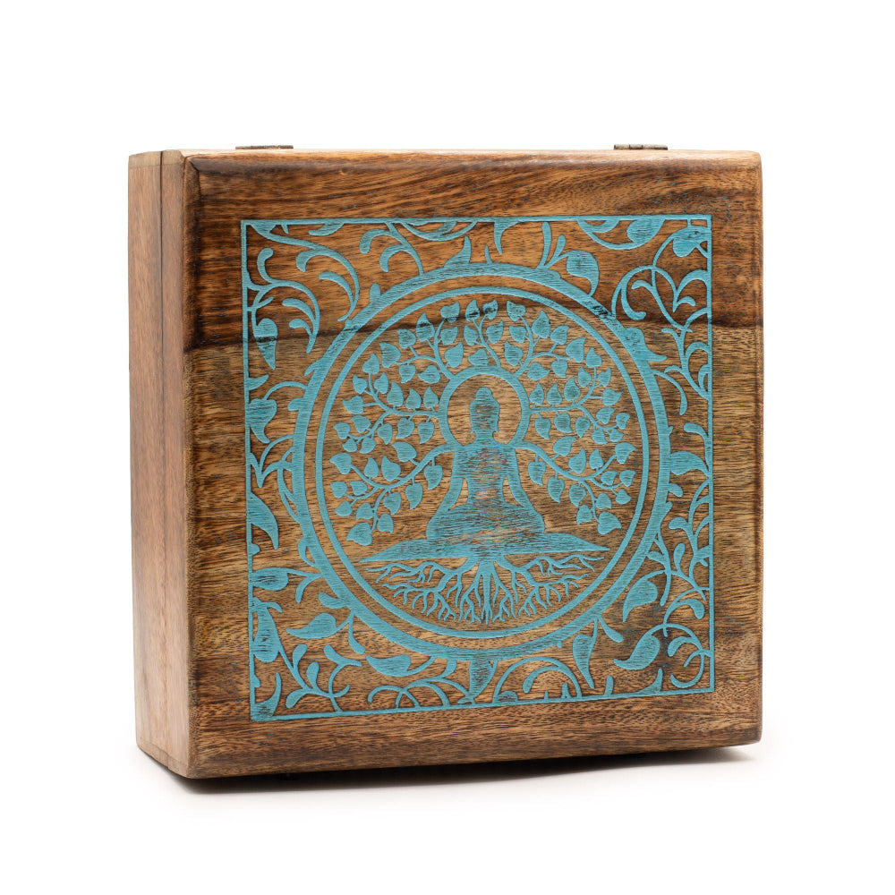 Wooden box with teal laser-cut design on a white background