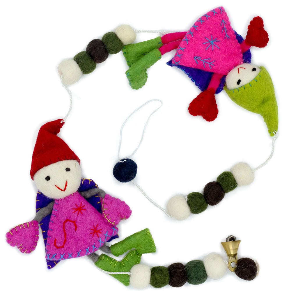 Colorful felt gnome ornaments on a white background
