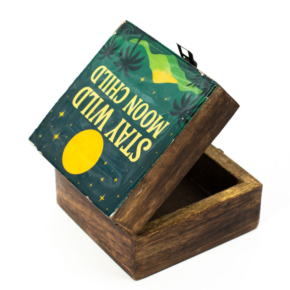 Wooden box with a green lid featuring yellow text and a yellow circle on a white background