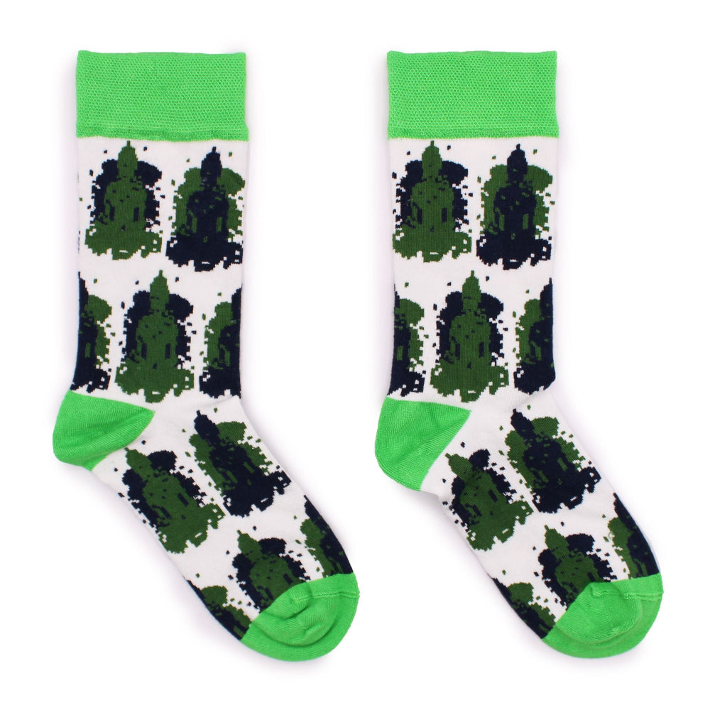 Pair of socks with green and black pattern on a white background