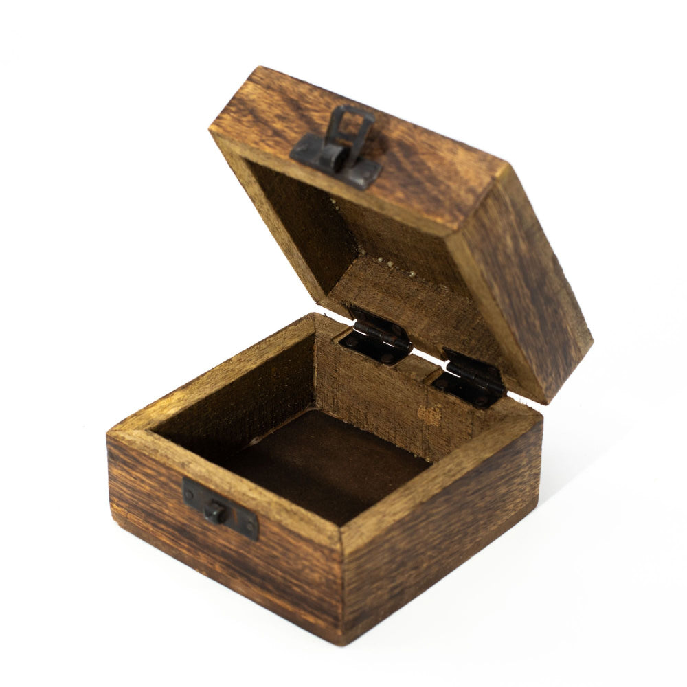 Wooden jewelry box with a hinged lid on a white background