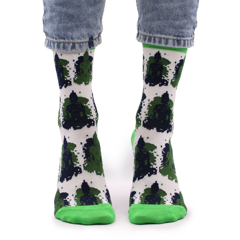 Green and black patterned socks with white background