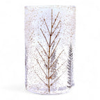 Clear glass candle holder with tree design and gold speckles on a white background