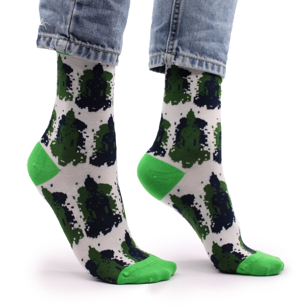 Green and black patterned socks with white background