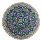 Round mandala rug with green and blue patterns on a white background