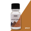 Bottle of Apple Spice fragrance oil with a black cap on a white background