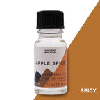 Bottle of Apple Spice fragrance oil with a black cap on a white background