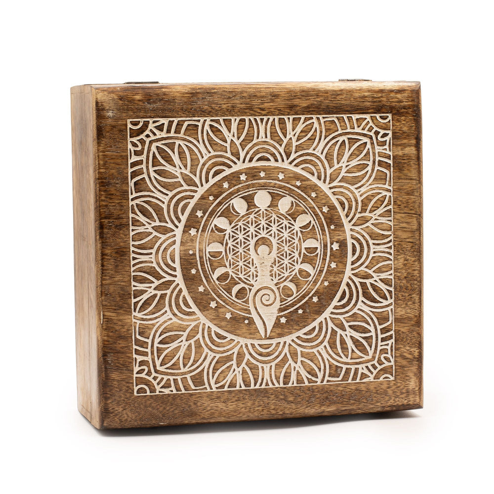 Wooden box with intricate white design on a white background