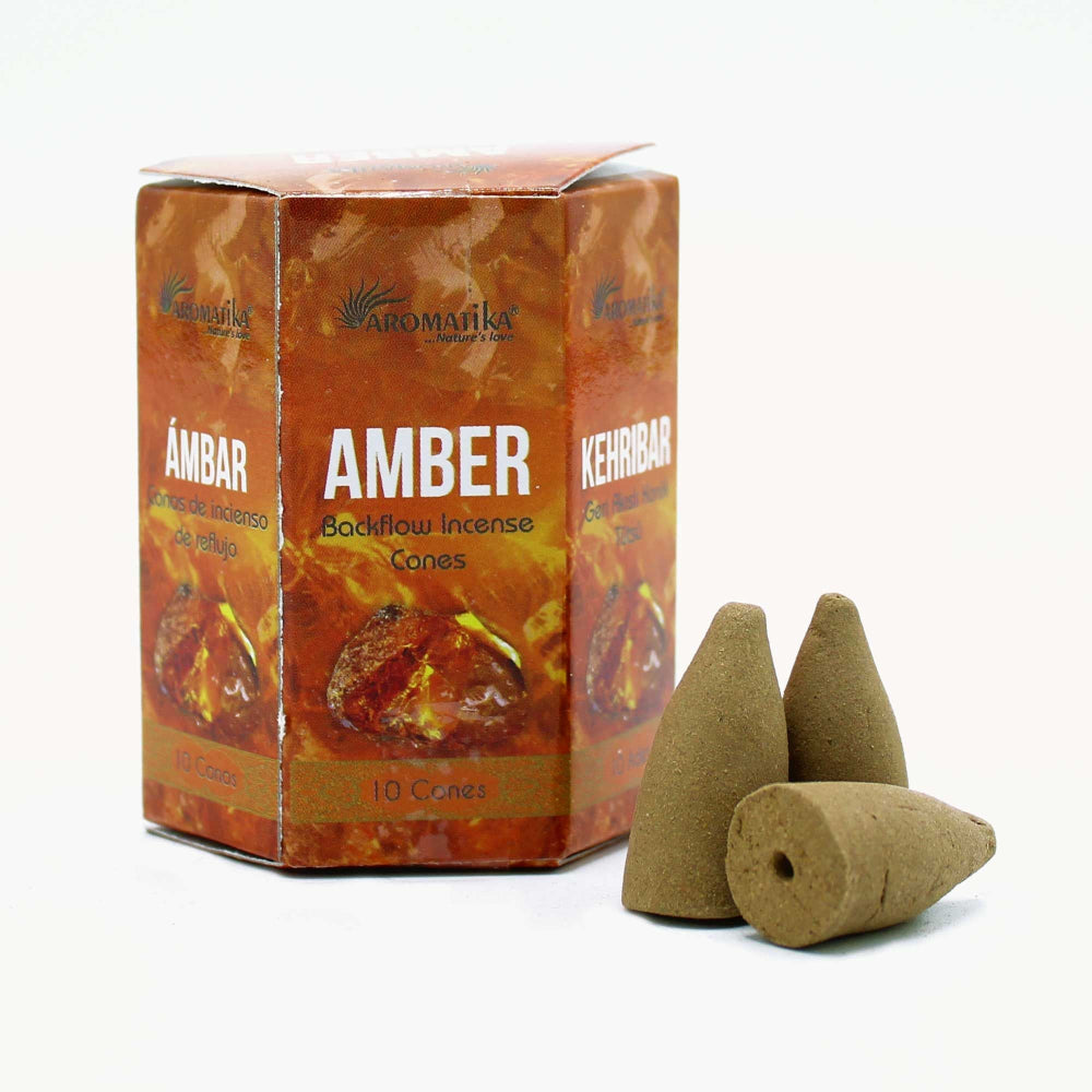 Box of Aromatica Amber incense cones with two cones on a white background