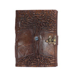 Brown leather journal with tree design and metal clasp on a white background