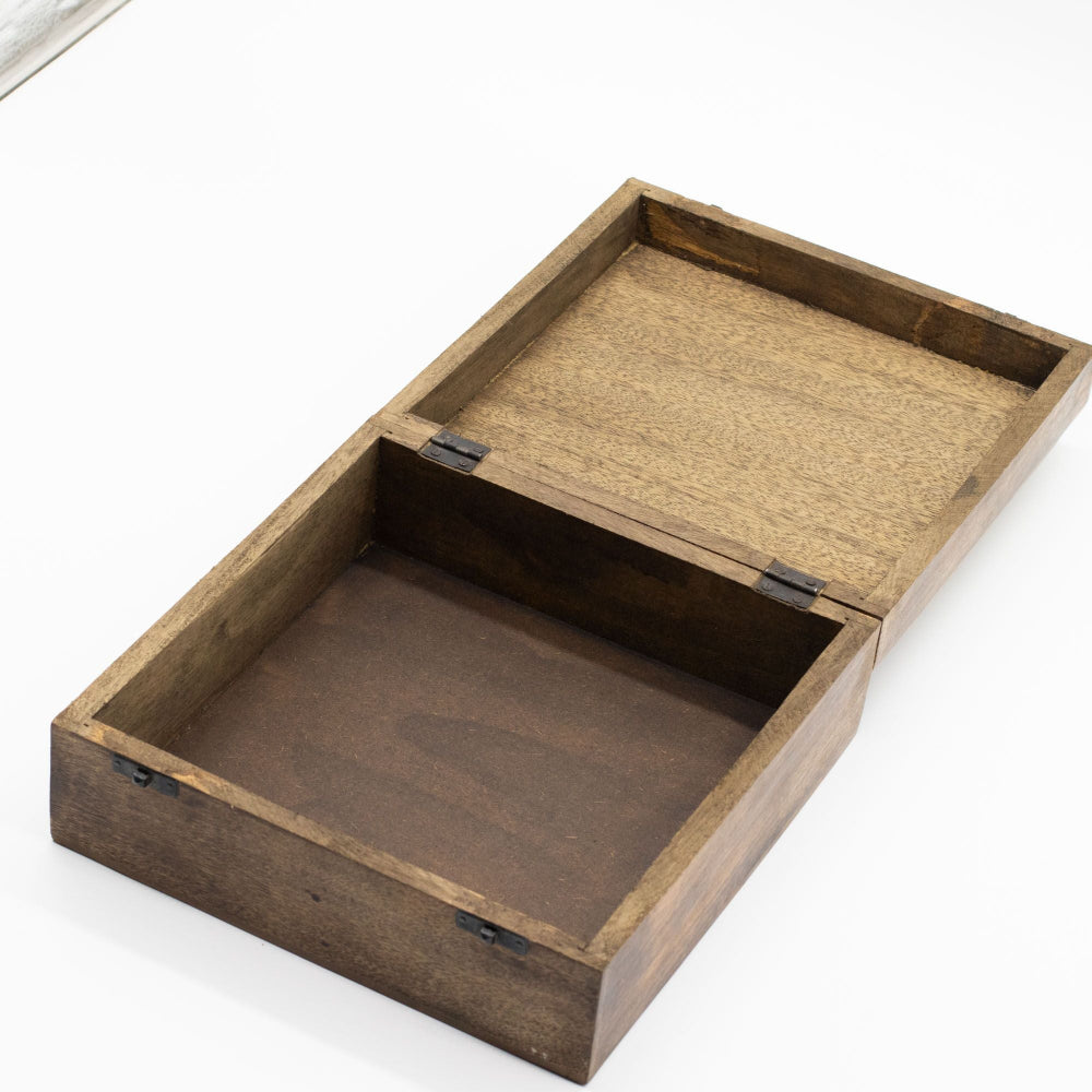 Wooden box with a lid on a white background