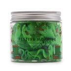 Green whipped soap in a jar with festive design on a white background