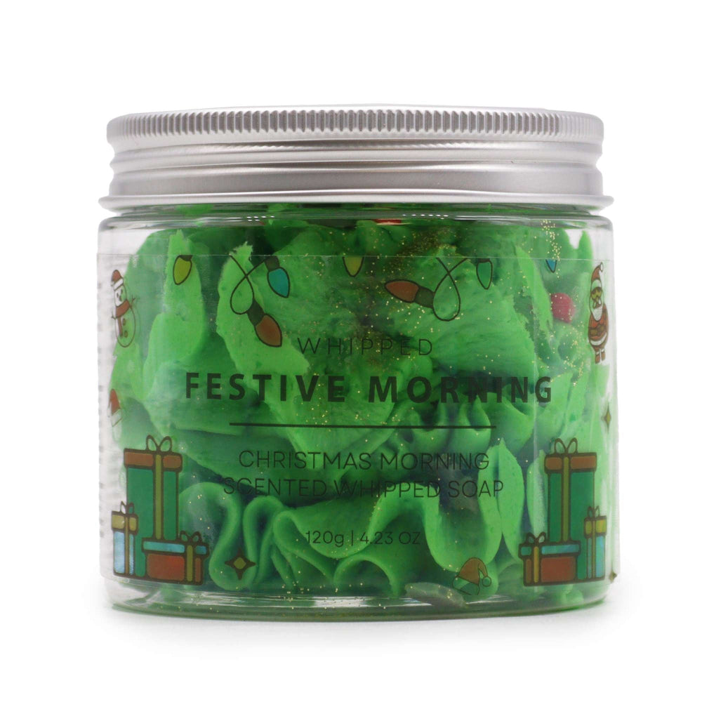 Green whipped soap in a jar with festive design on a white background