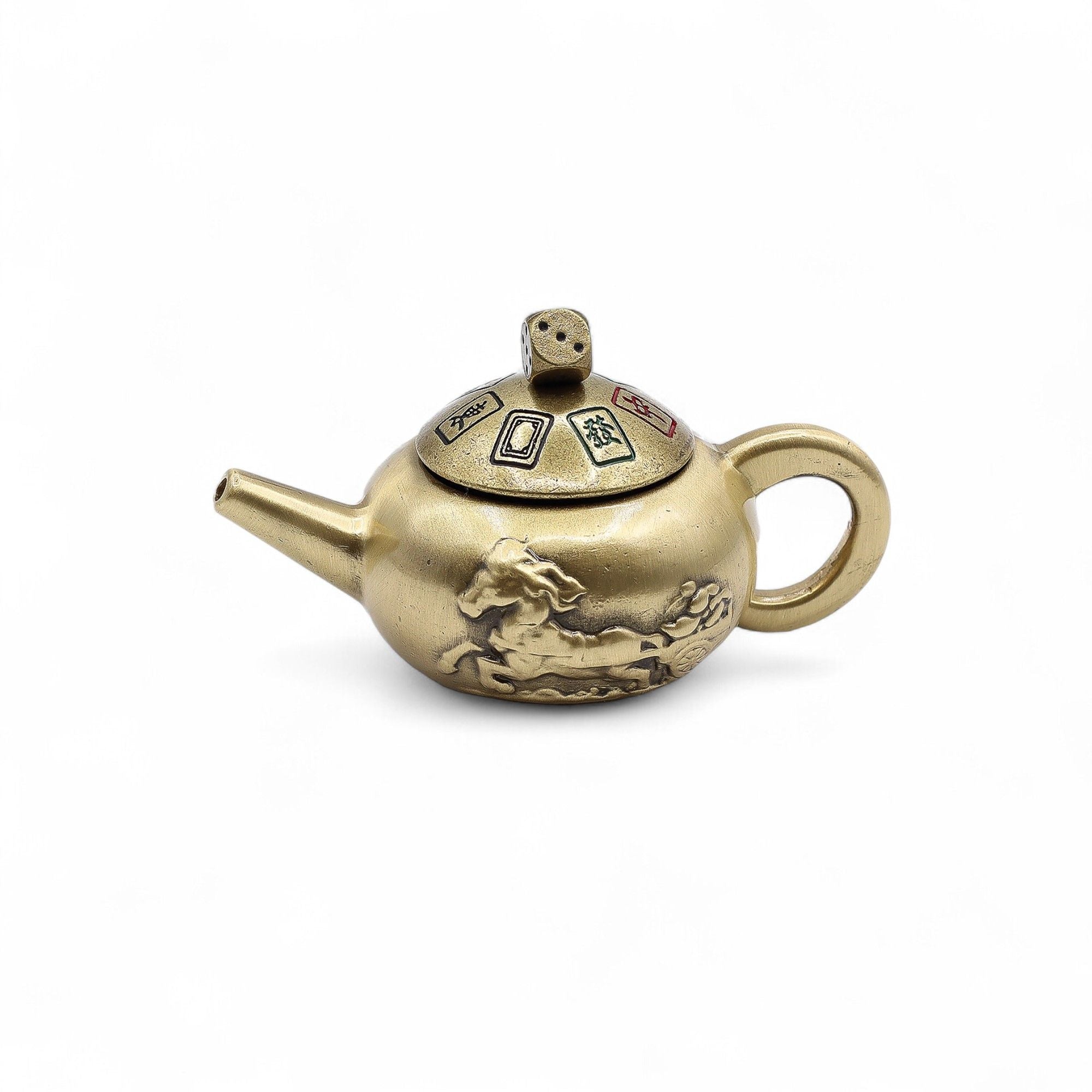 Brass teapot with decorative elements on a white background