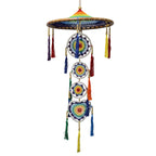 Colorful dreamcatcher with circular designs and tassels on a white background