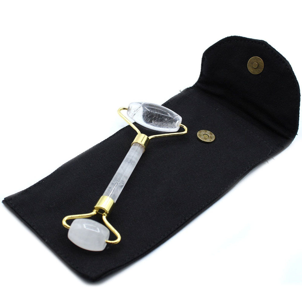Glowing crystal roller on a black cloth with gold accents