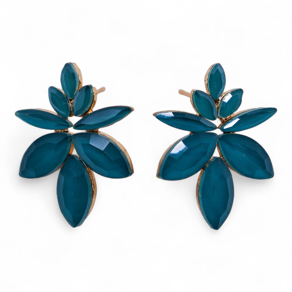 Pair of blue leaf-shaped earrings on a white background