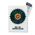 Notebook with a colorful mandala design and 'Real Life Happens Offline' text on a white background.