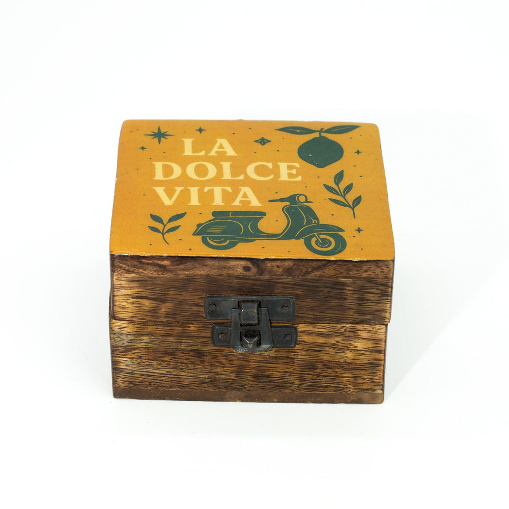 Wooden box with a yellow lid featuring 'La Dolce Vita' text and scooter illustration on a white background.