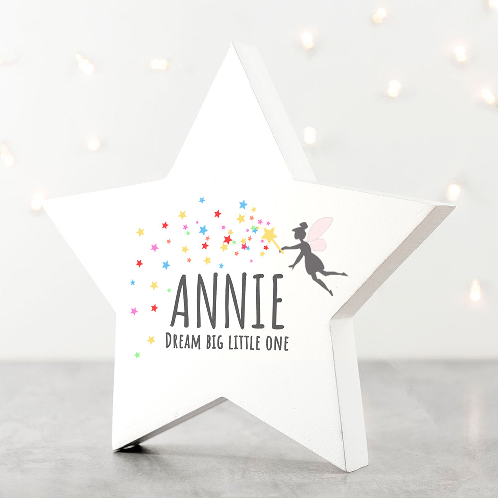 White star-shaped night light with 'ANNIE' and 'Dream Big Little One' text, featuring a silhouette of a child holding stars.