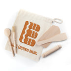 Baking set with a drawstring bag featuring a gingerbread man design and text on a white background.