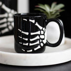 Eleanoras Skeleton Hand Mug Mugs