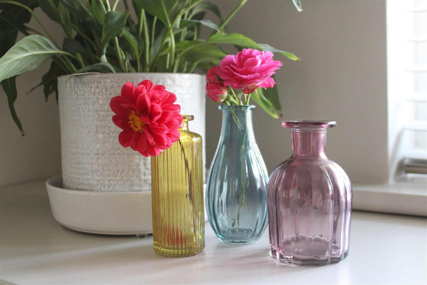 SET OF THREE COLOUR VASES